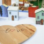 a wooden heart with the word love written on it